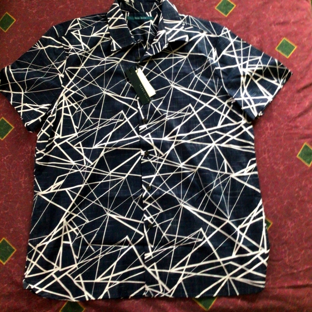 A black and white Perry Ellis shirt. Size: LARGE.